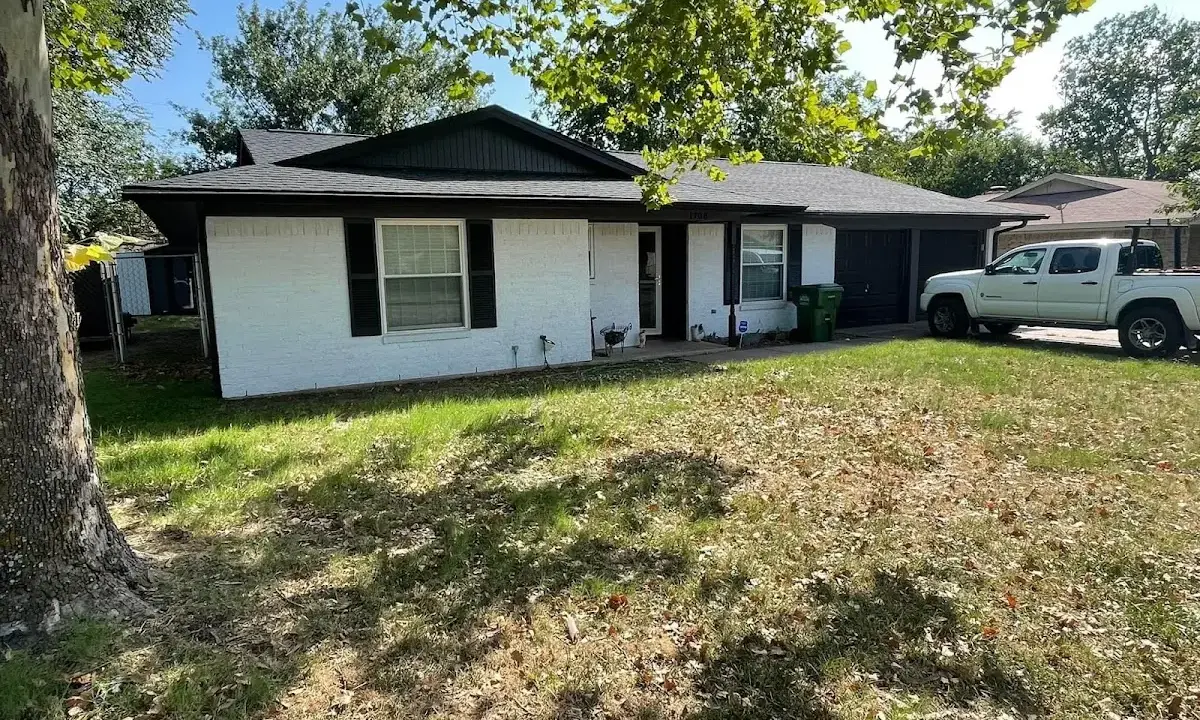 Professional roofing crew working on a residential roof in Southwest Ranches